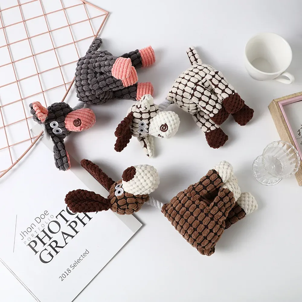 This plush dog toy combines entertainment with dental benefits, offering a solution for pet businesses seeking toys that promote healthy oral hygiene while providing a fun chewing experience.