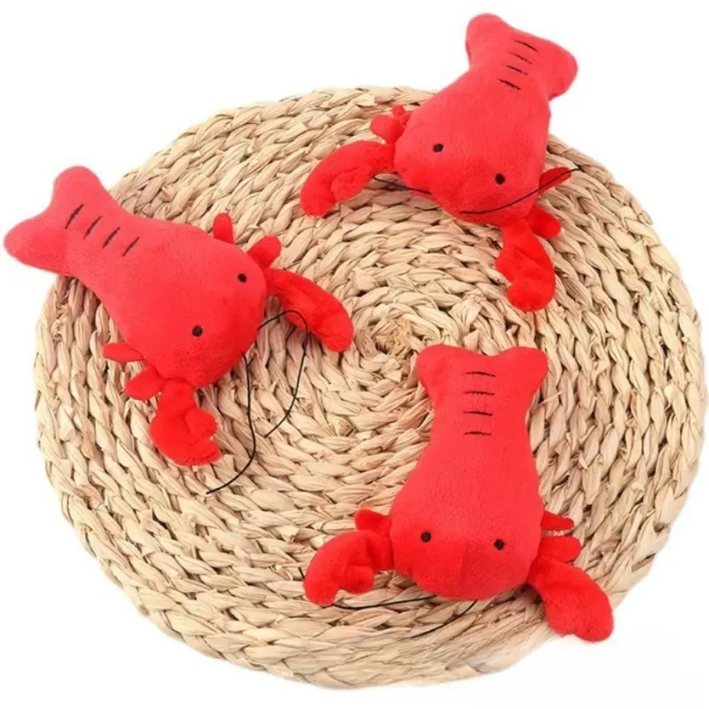 The plush sound lobster chew toy features an engaging built-in sound device, making it perfect for interactive play and ideal for pet retailers looking for toys that keep dogs entertained for hours.