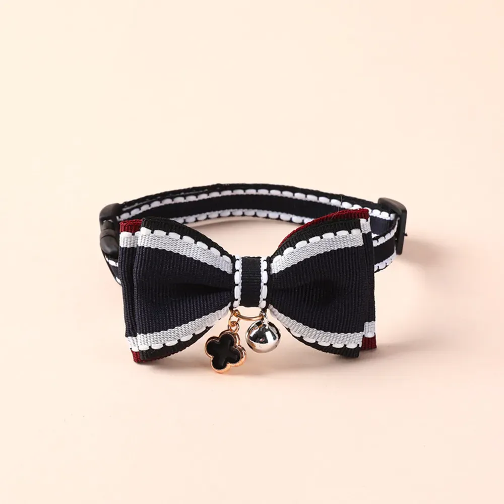 Fashionable double-layer bow tie pet collar with adjustable length, durable alloy buckle, and charming bell – perfect for small dogs and cats.