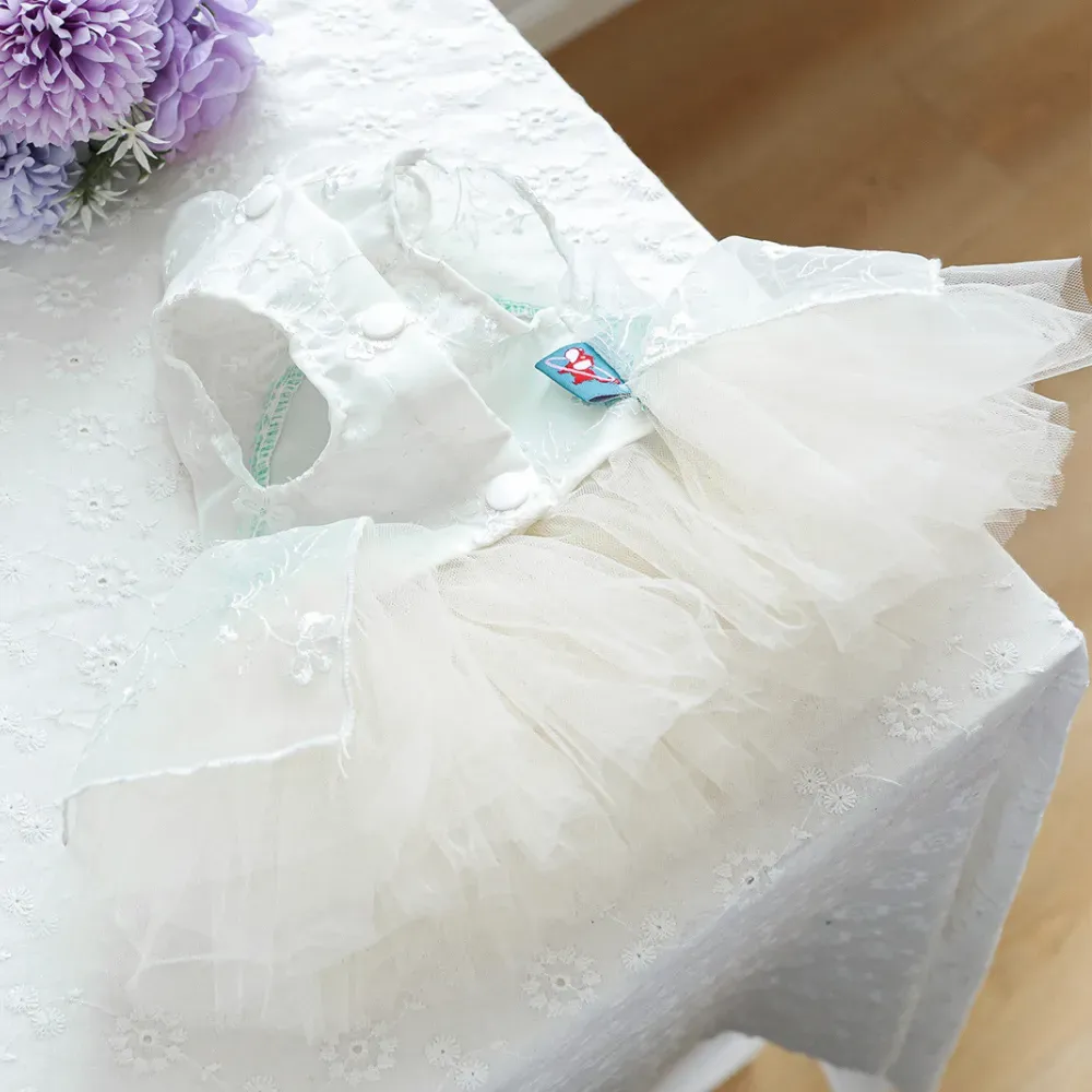 The pearl necklace accent adds a touch of luxury and sophistication, making this dress a standout choice for stylish pets attending special events.