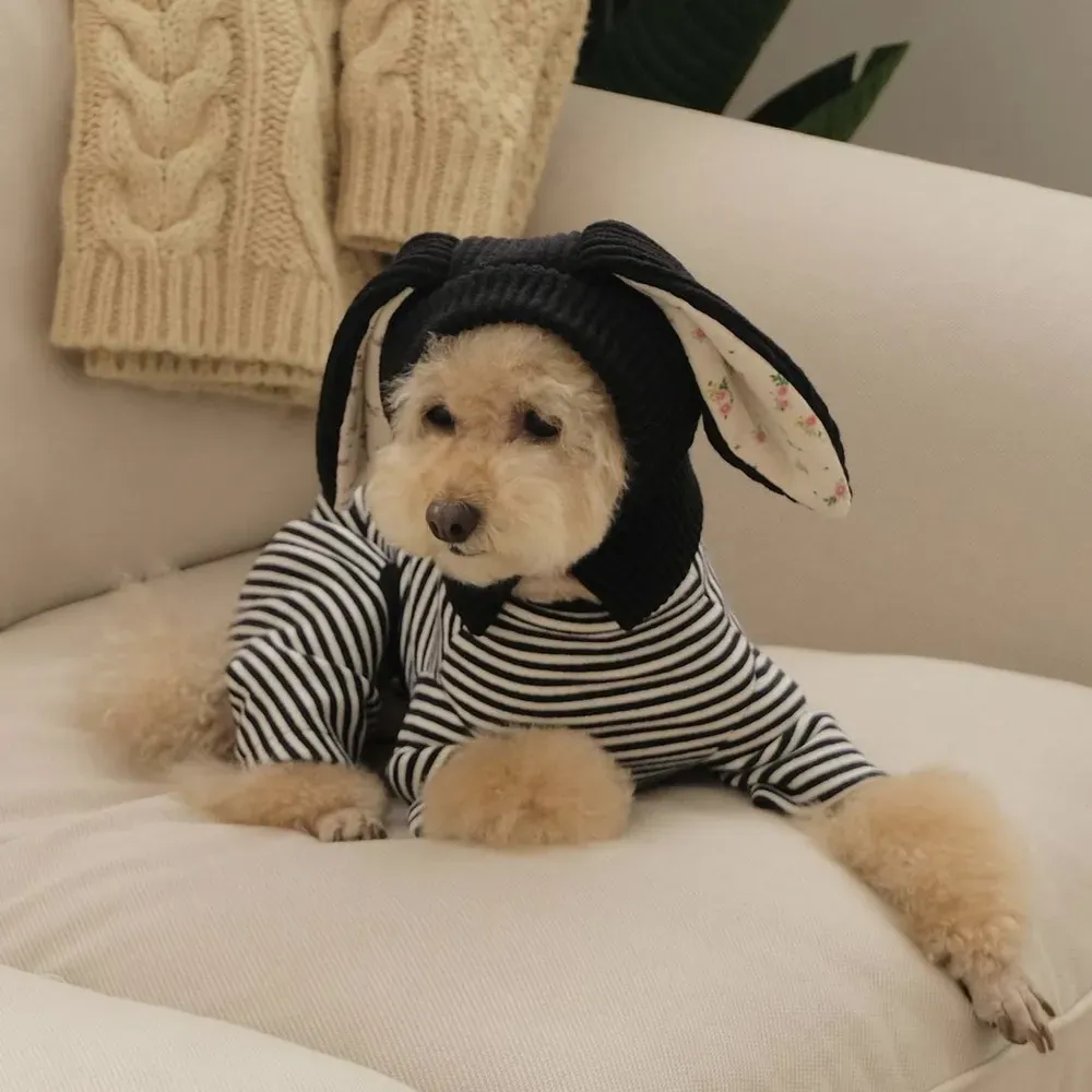 Stylish pet hat with bunny ears for fall and winter, soft cotton floral lining for comfort.