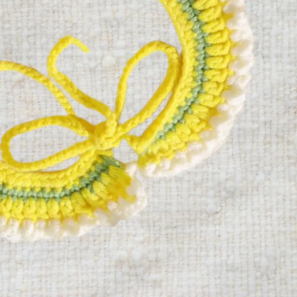 Soft, comfortable crochet scarf for pets, featuring a vibrant 3D orange design.
