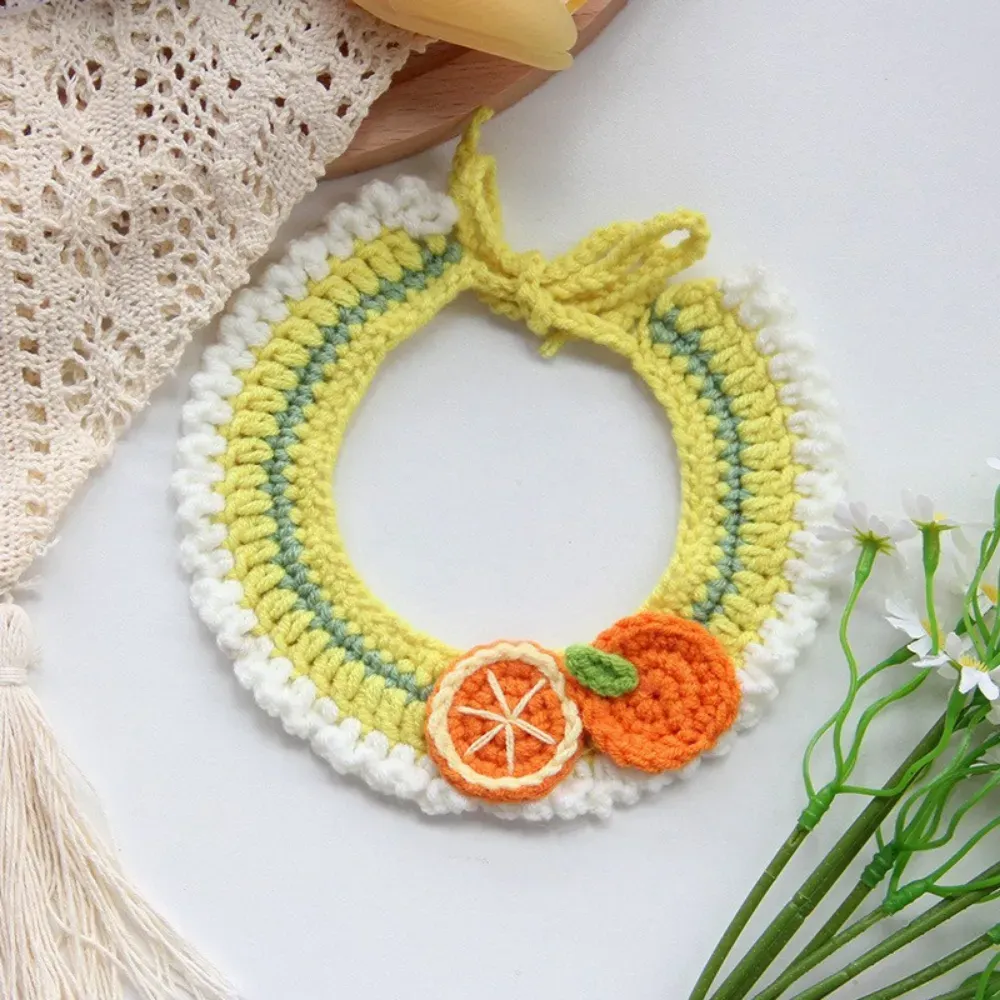 Adorable crochet scarf with 3D orange accent, perfect for small dogs and cats.