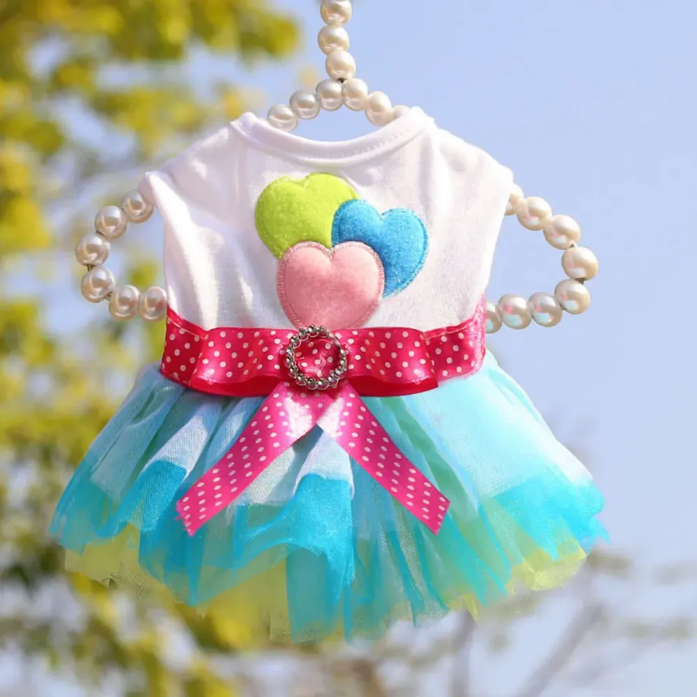Designed with a layered tulle skirt, this dress gives pets a graceful and charming appearance, perfect for stylish outings.