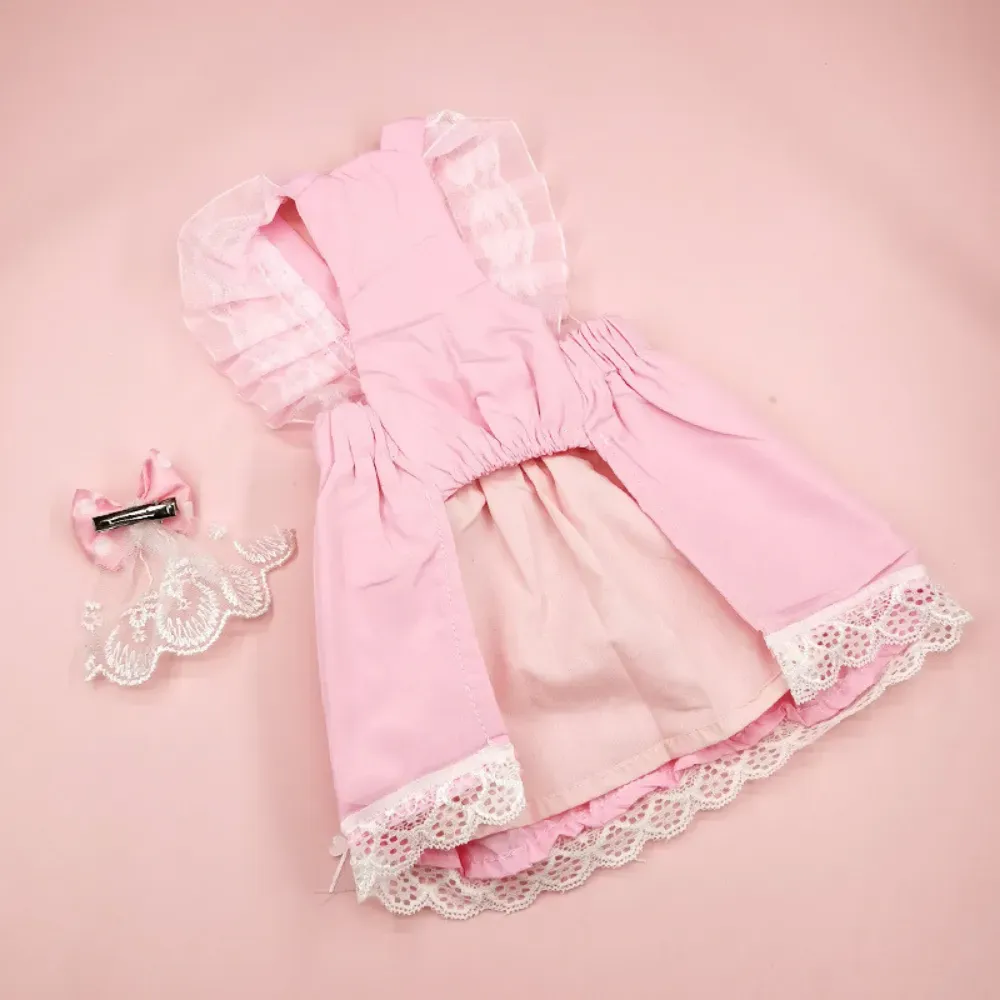 "Coordinated pet outfit in soft pink tones adds elegance to any pet apparel collection."