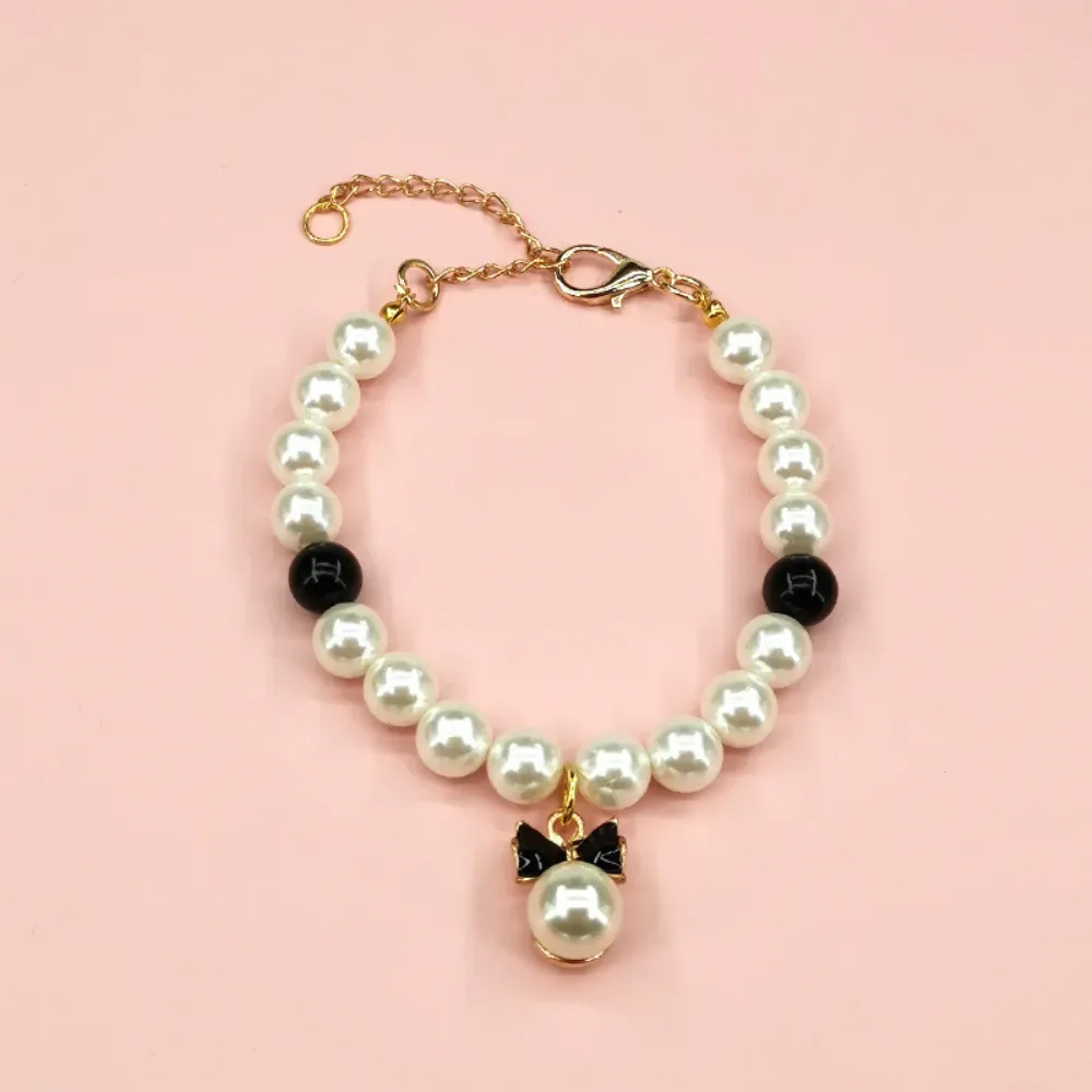 "Tailored for small to medium dogs, this pet fashion set includes a dress, necklace, and clip for a coordinated look."