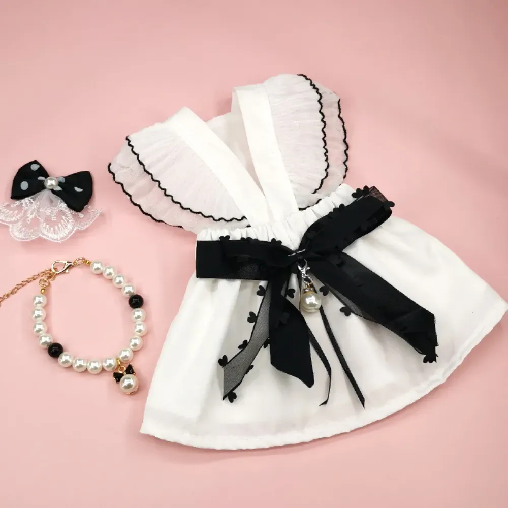 "Complete pet fashion set including a bow decor dress, necklace, and hair clip for small to medium pets."
