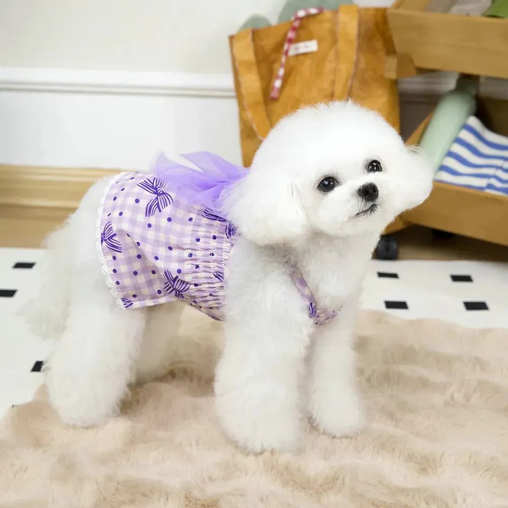 "Boutique pet dresses with floral and bow details, ideal for special events and upscale pet clothing stores."