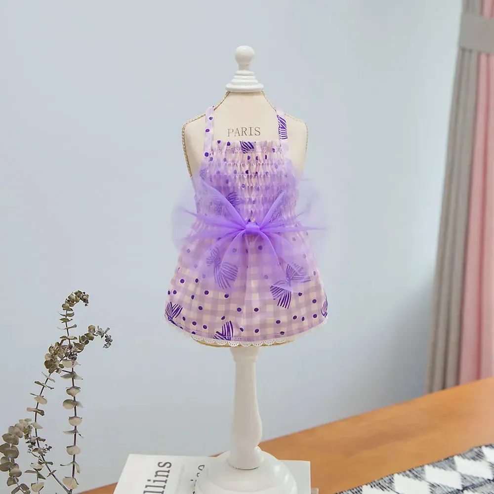 "Boutique pet dresses with floral and bow details, ideal for special events and upscale pet clothing stores."