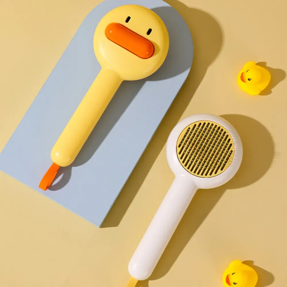 "Bright yellow pet grooming brush with duck design – a must-have for pet retailers, online shops, and grooming kits."