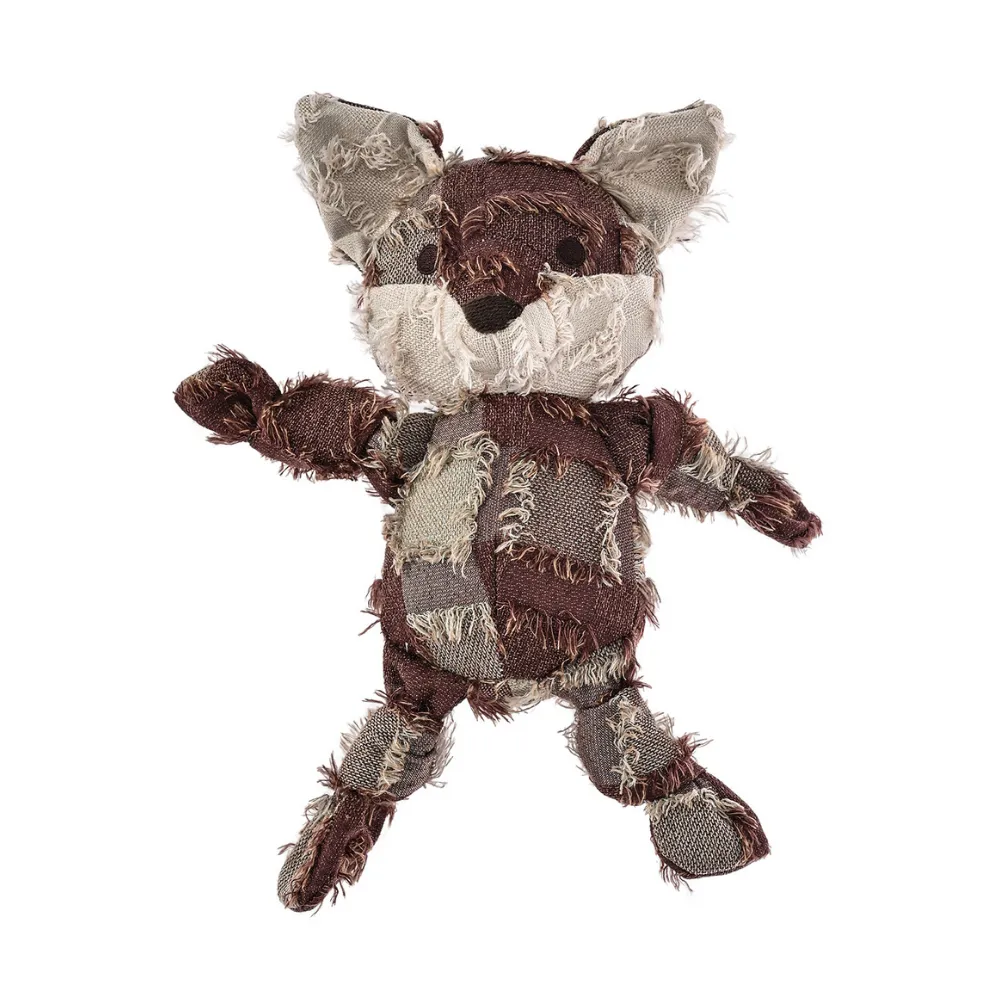 Handcrafted yarn-dyed fabric patchwork fox dog toy isolated on a white background.