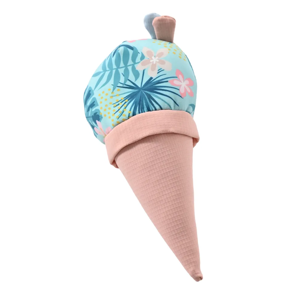 Close-up isolated view of the ice cream toy scoop showing blue tropical leaf and pink hibiscus flower patterns.