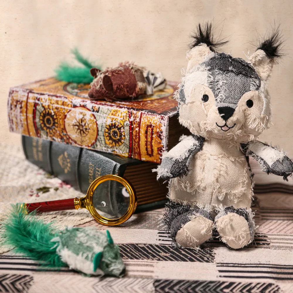 A collection of hippie style plush toys including a squirrel and other animal characters displayed on vintage books.