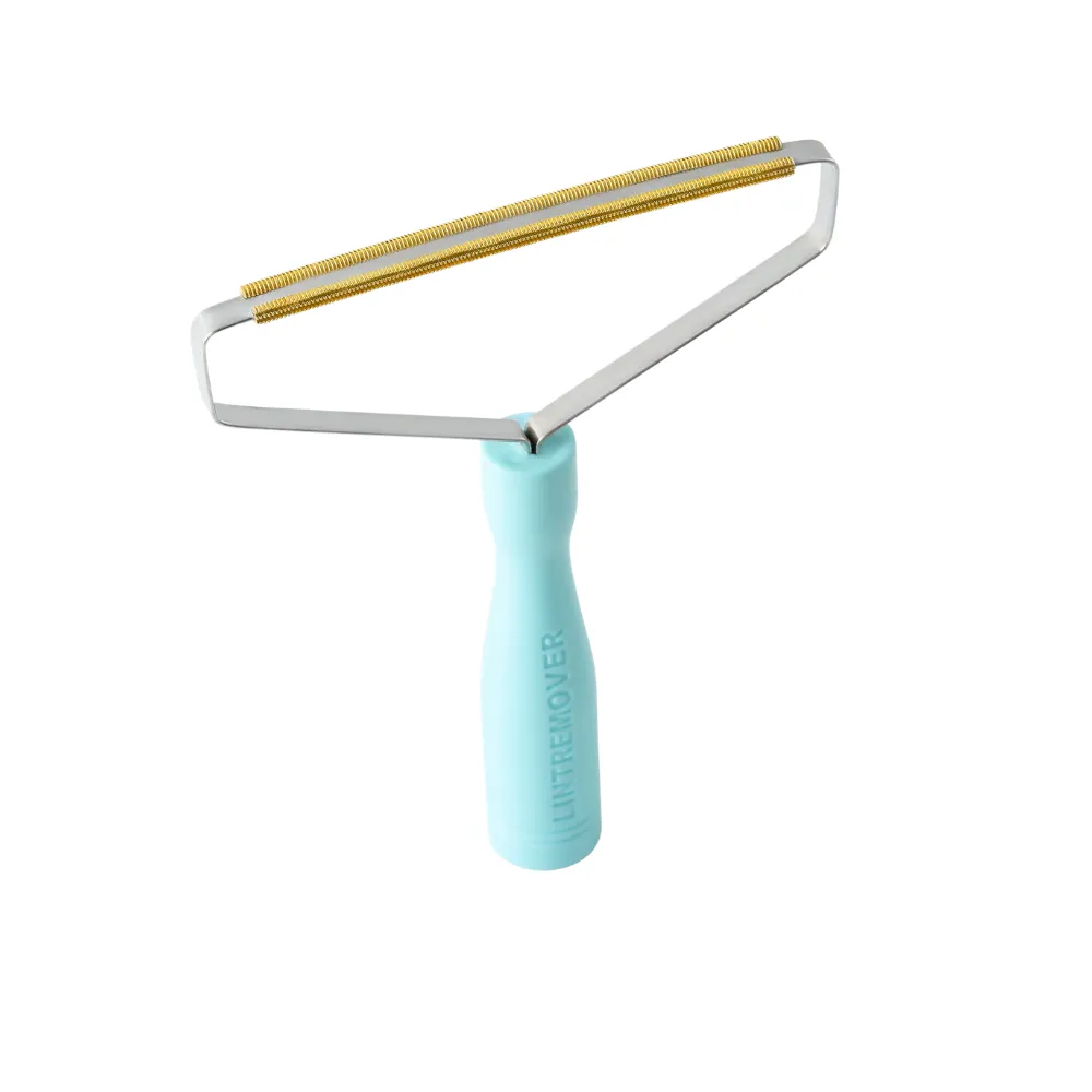A single blue manual lint remover with a stainless steel frame and textured copper blade on a white background.