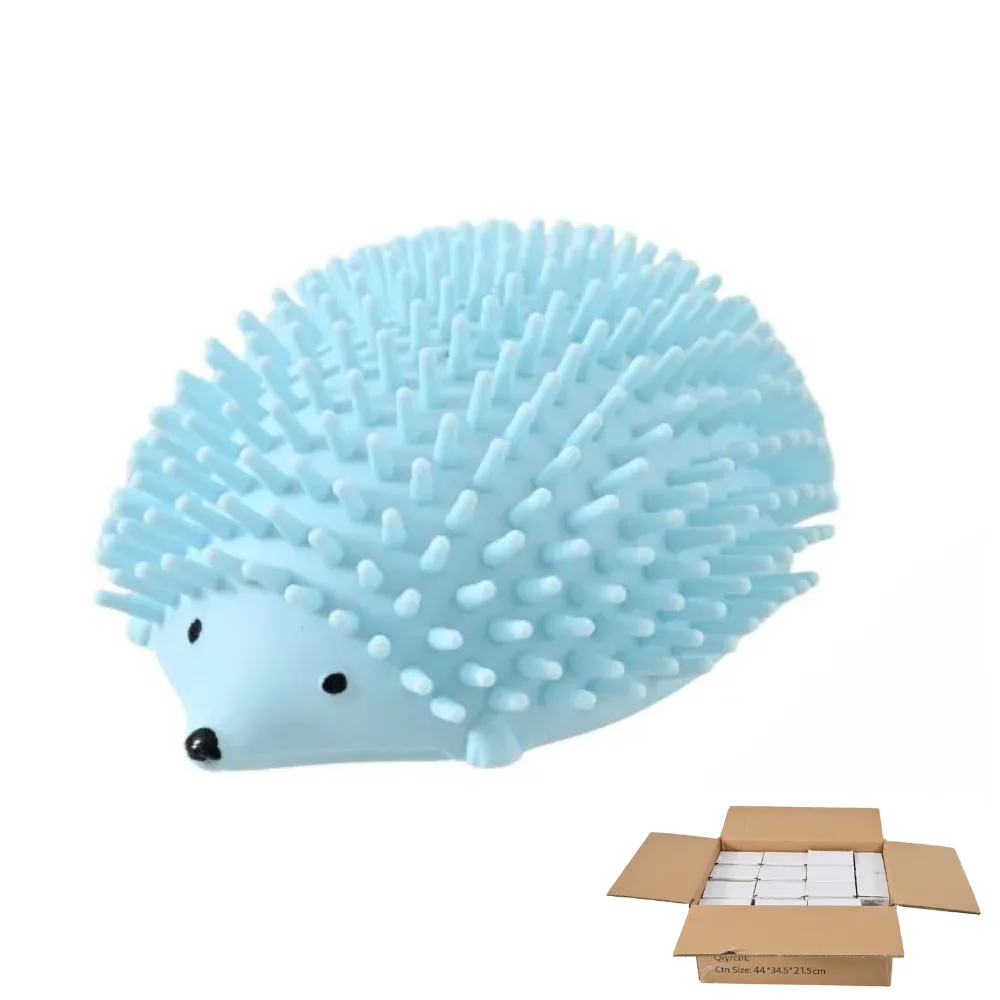 Light blue hedgehog-shaped cat grooming brush and a cardboard shipping carton.