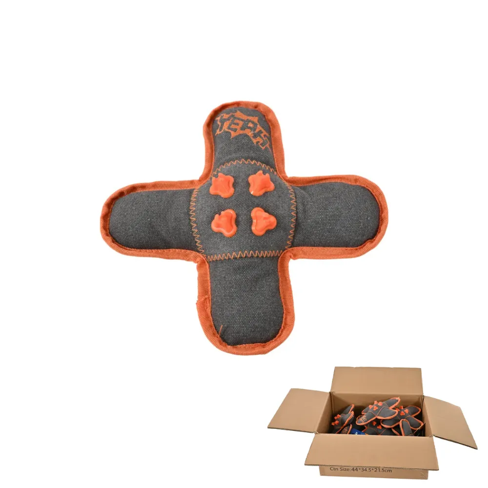 A cross-shaped dog toy displayed above an open cardboard shipping box filled with the same toys for wholesale distribution.