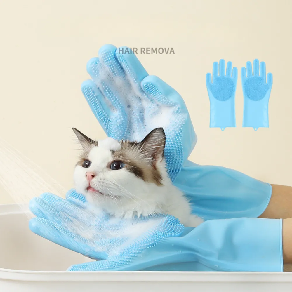 silicone-cat-bath-grooming-gloves-foaming A close-up of a long-haired cat in a bath being massaged by foam-covered, light blue silicone grooming gloves.