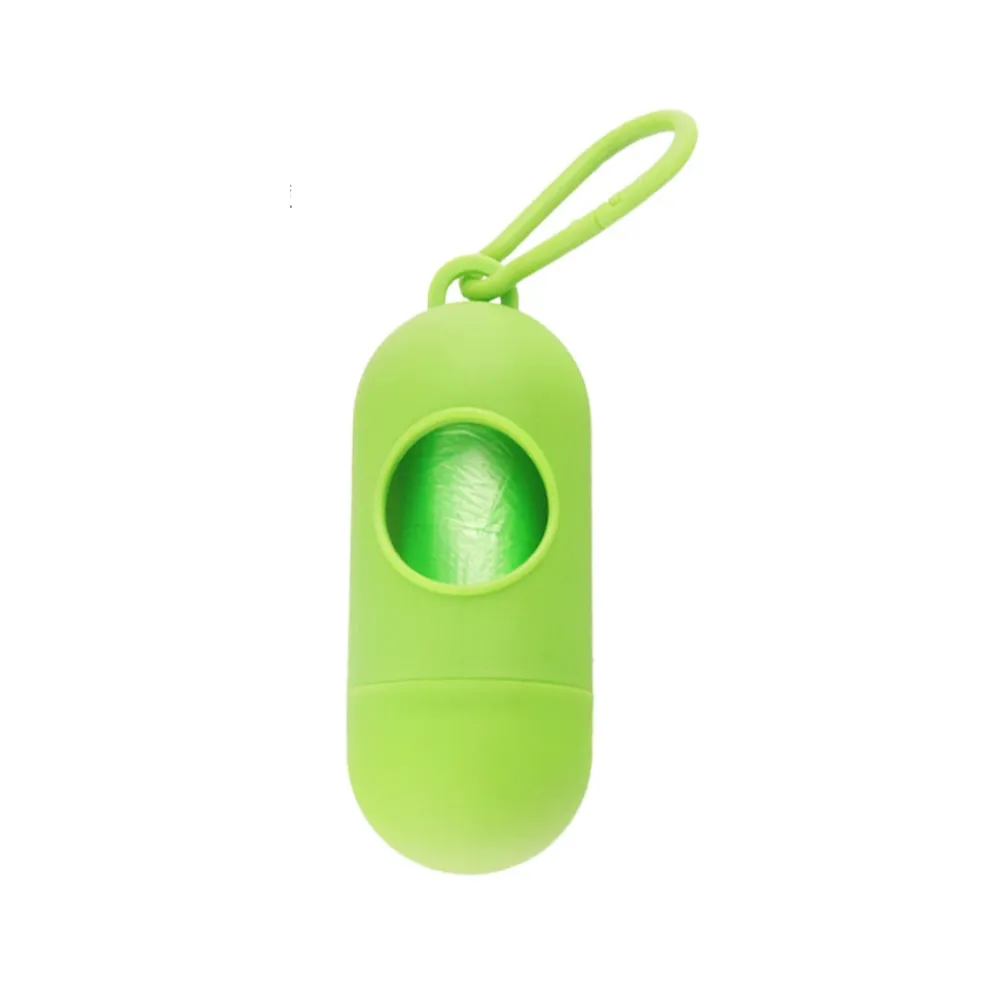 Close-up of a neon green pill-style dog poop bag dispenser with a matching carabiner clip.