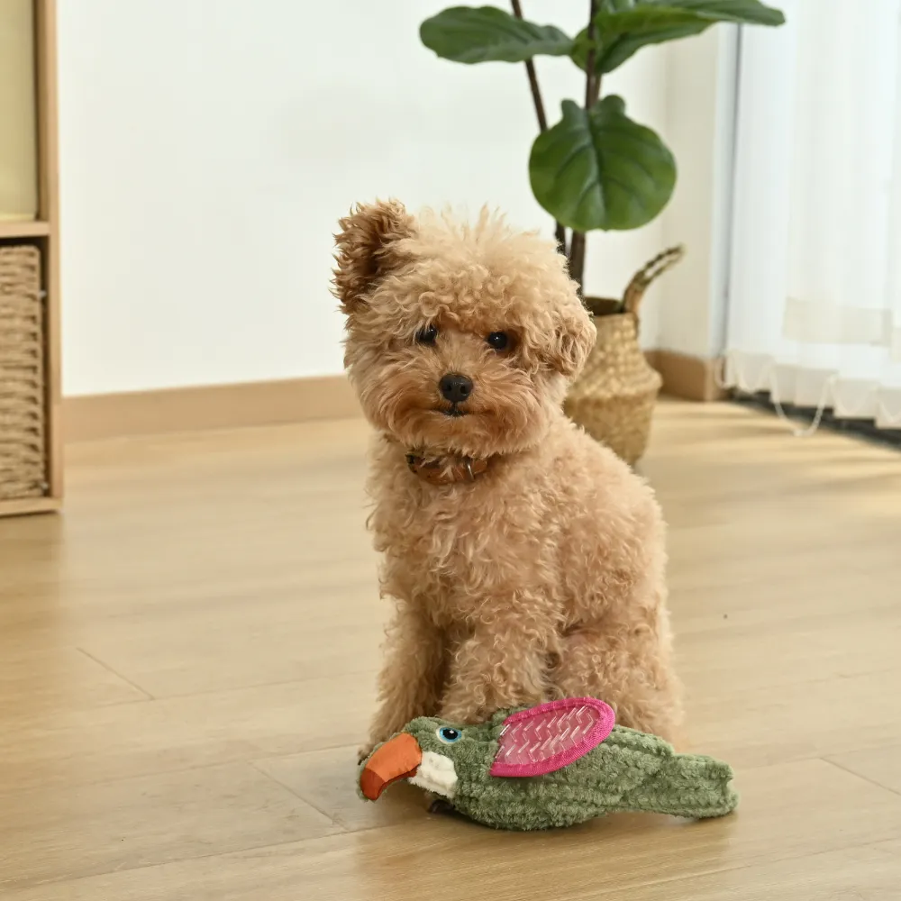 small dog playing with plush bird squeaky dog toy indoor interactive dog toy for enrichment