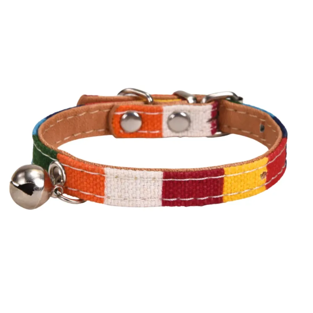 Side view of a colorful striped pet collar with silver hardware and bell on a white background.