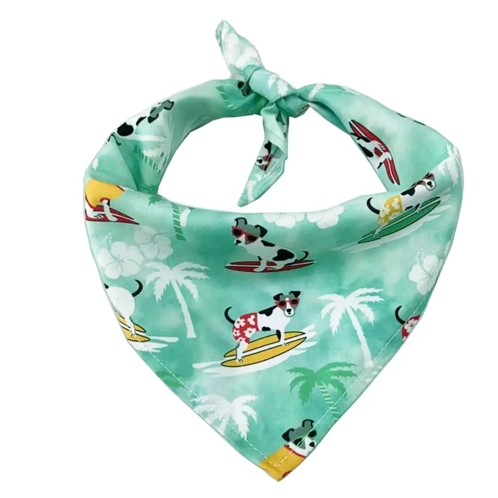 A mint green dog bandana featuring illustrations of dogs wearing sunglasses and surfing on boards among palm trees.