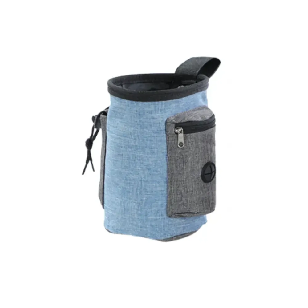 Close-up of a blue fabric dog treat pouch featuring a gray zippered pocket and waste bag exit hole.