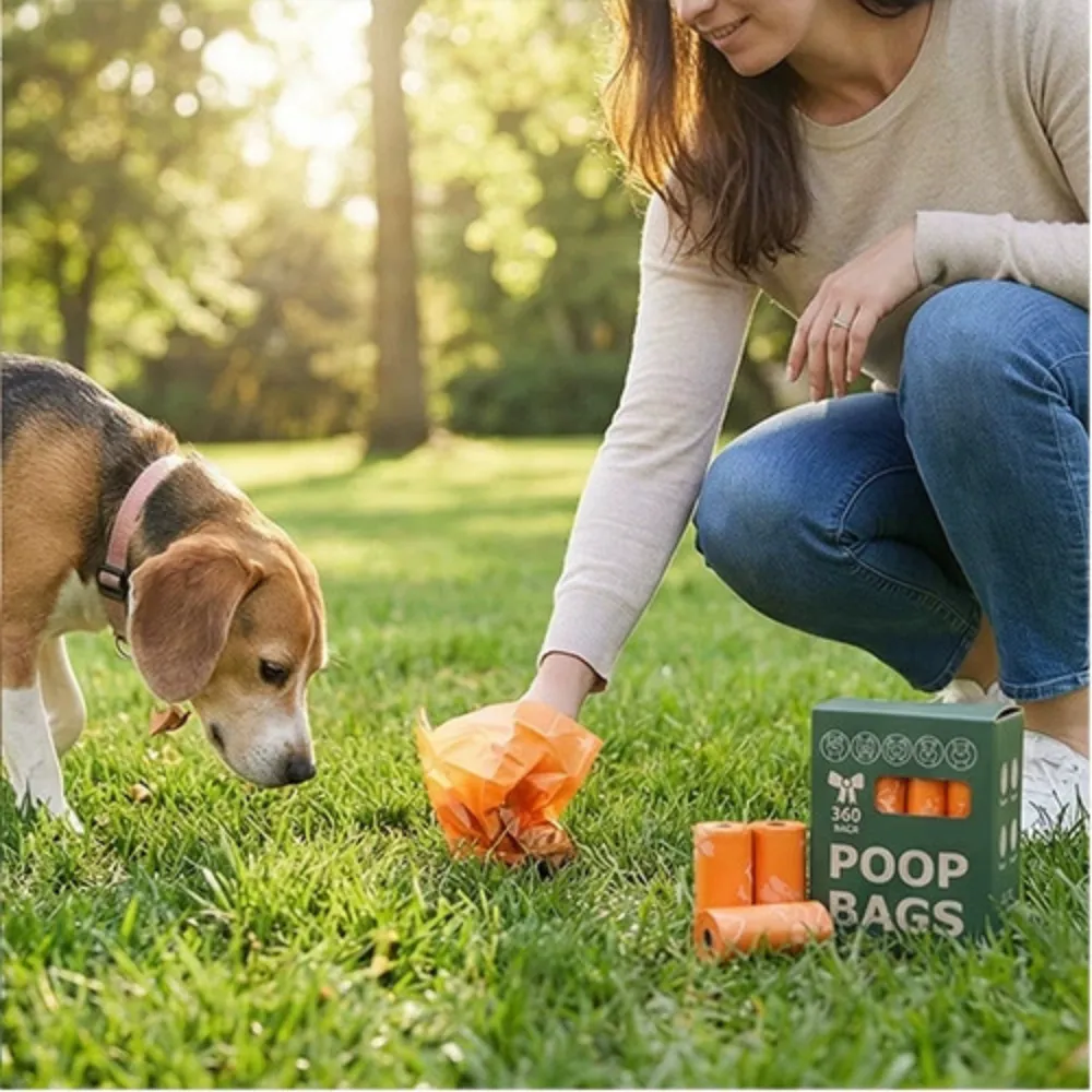 A person picking up waste with an orange biodegradable bag in a park with a beagle.