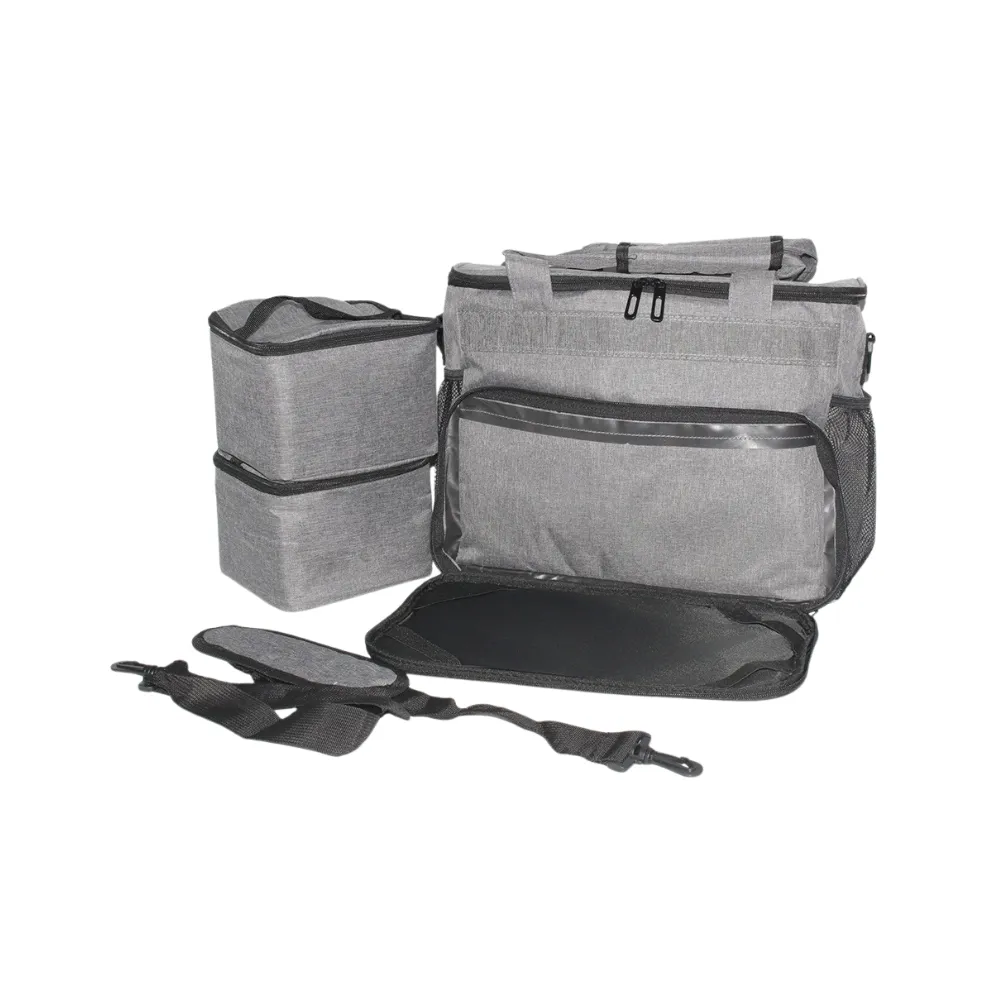 Isolated view of the grey pet travel organizer with stacked food containers and adjustable carry strap.