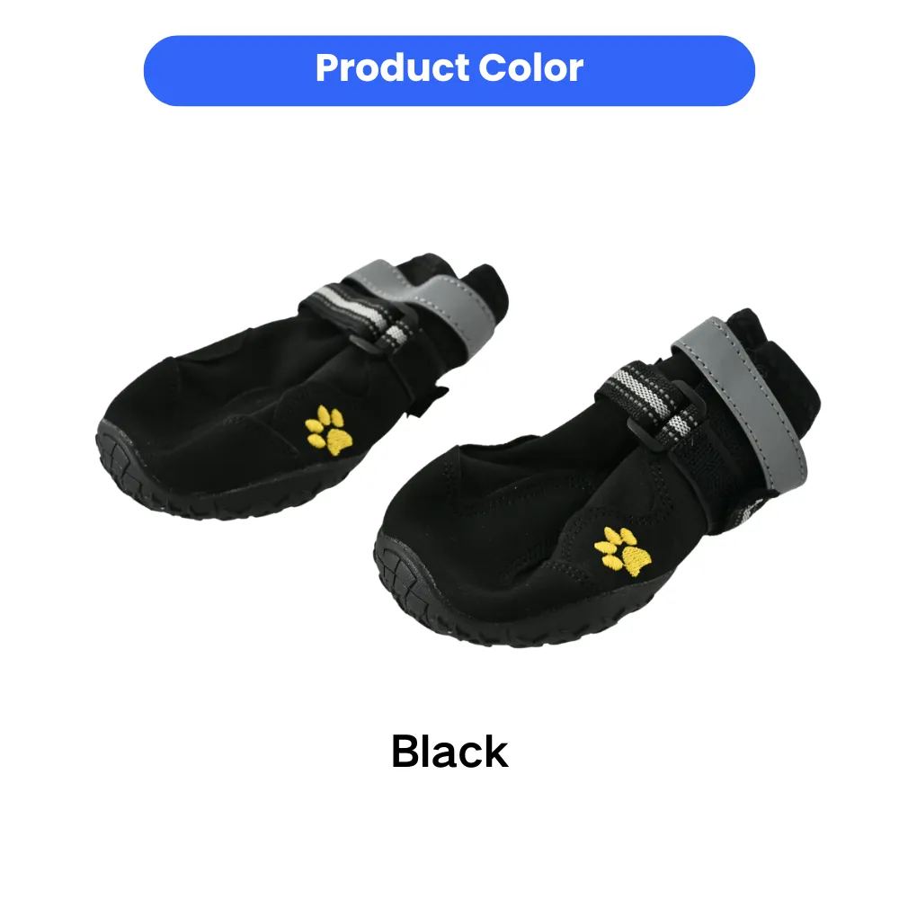 Close-up of a pair of black dog shoes with anti-slip rubber soles and adjustable velcro straps.