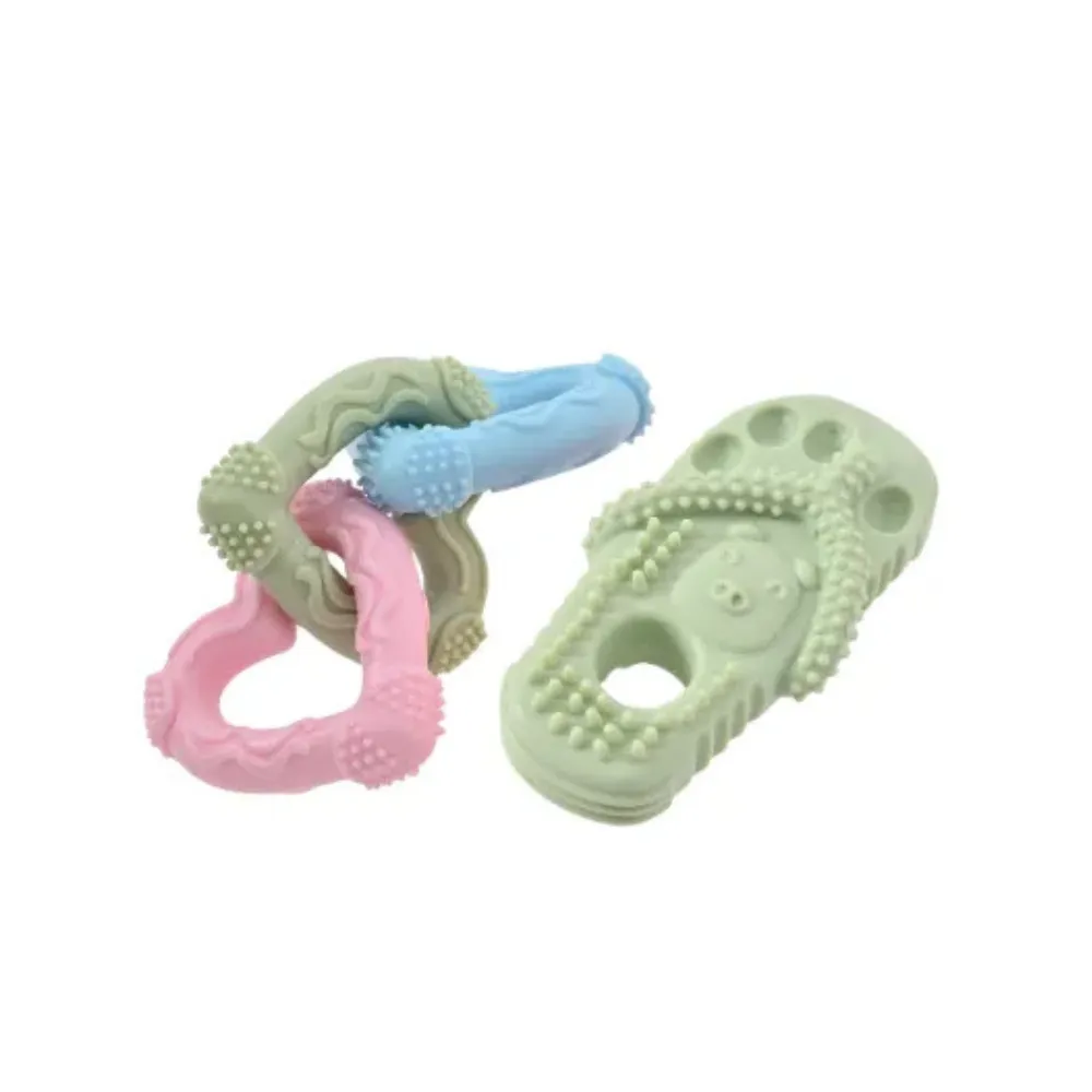 Mint green slipper dog toy with a cute pig face design and textured surface for dental health.