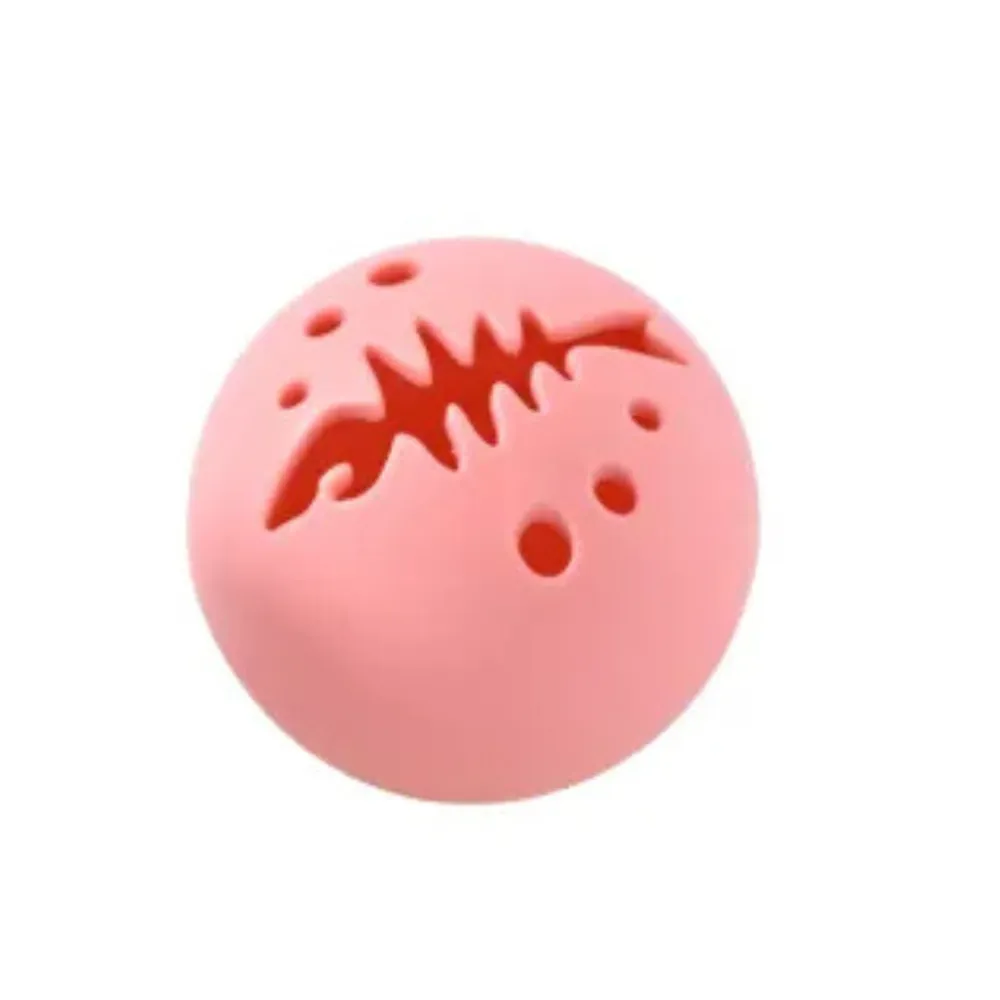 Close-up of the pink interactive cat toy ball with fish-bone shaped ventilation holes for scent dispersion.
