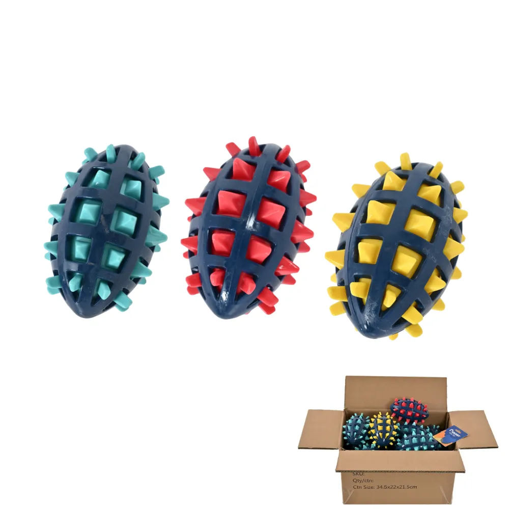 Wholesale-Squeaky-Football-Dog-Toys-Bulk-Pack A group of three spiked football-shaped dog chew toys in blue, red, and yellow next to a wholesale shipping carton filled with products.