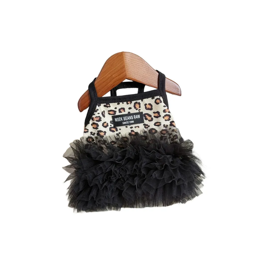 Leopard print puppy suspender dress with black layered tutu skirt displayed on wooden hanger
