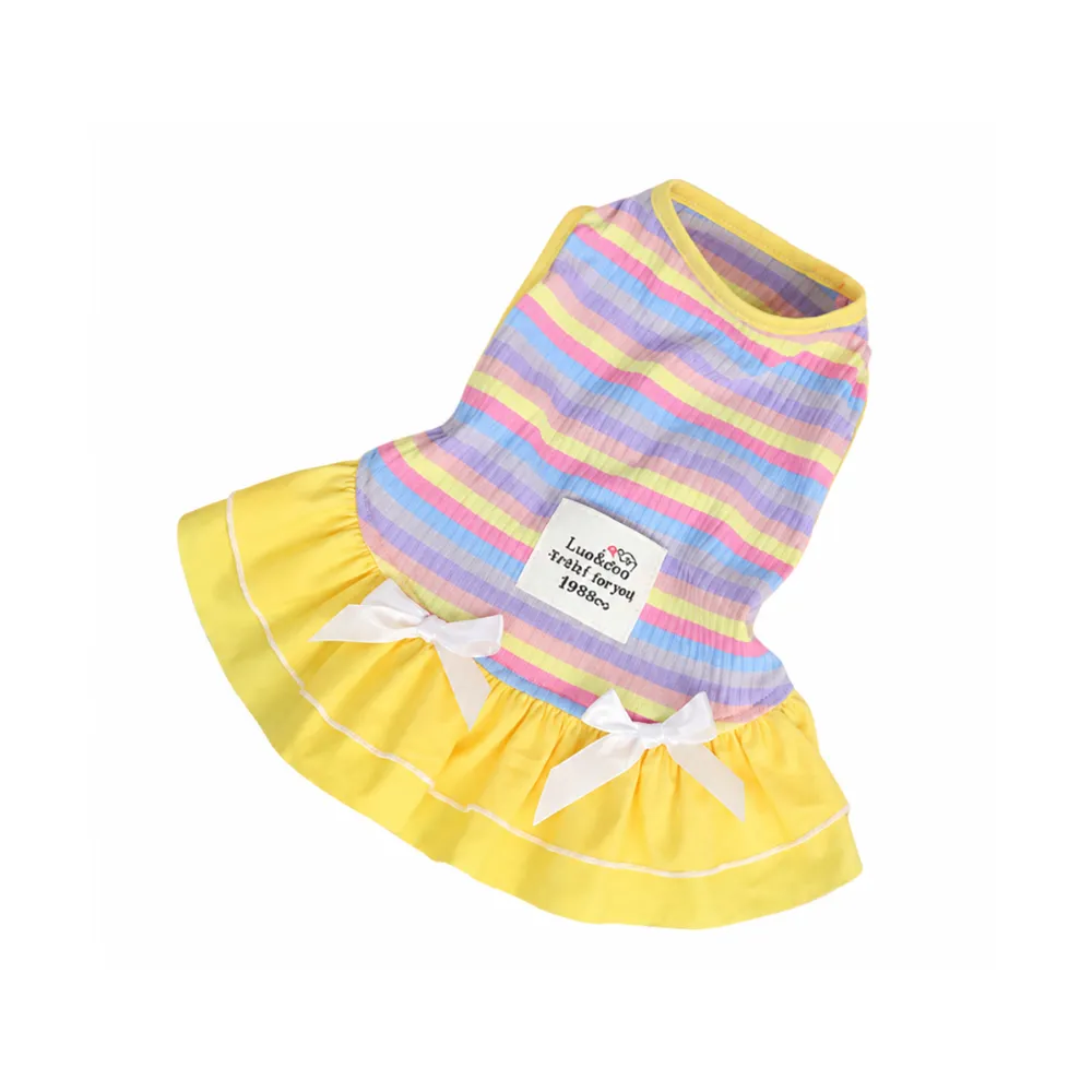 Pastel rainbow striped pet dress with yellow skirt and white bow accents for small dogs