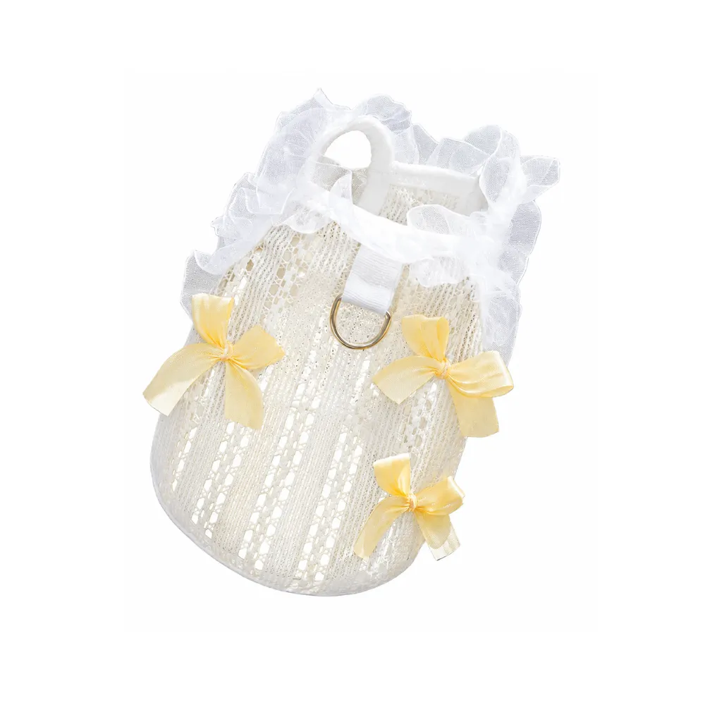 Yellow Bow Lace Dog Vest Product Display Yellow lace dog vest with ruffle trim and decorative bows isolated on white background