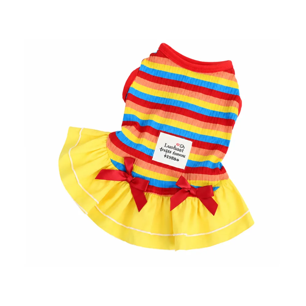 Red rainbow striped dog dress with yellow skirt and red bow details isolated on white background