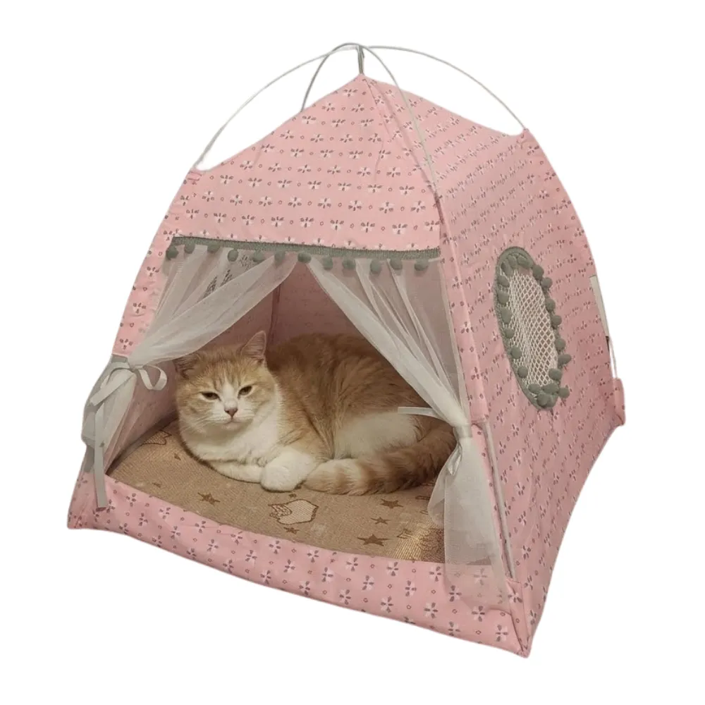 Pink Floral Summer Cat Tent with Ginger Cat An orange and white cat resting comfortably inside a pink floral patterned pet tent with sheer white curtains.