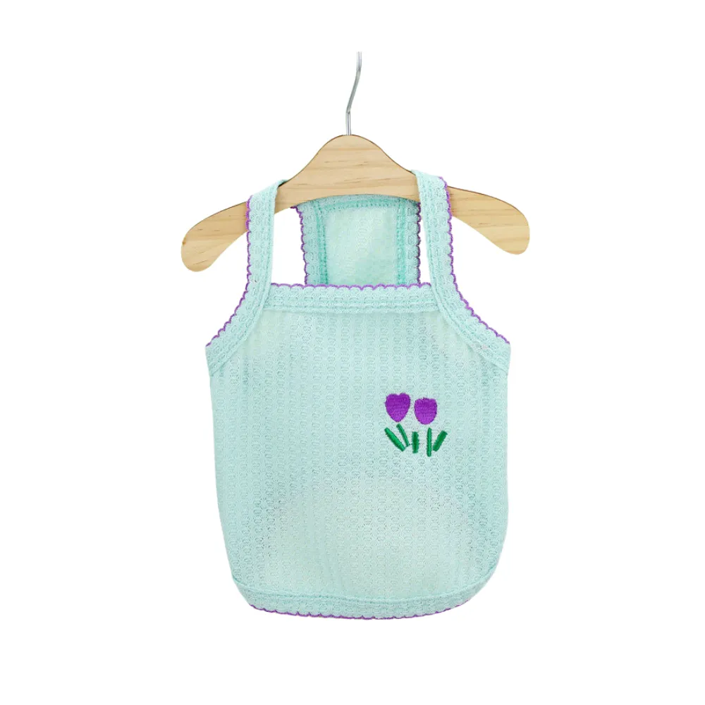 Mint green mesh puppy vest with purple tulip embroidery and purple scalloped trim.