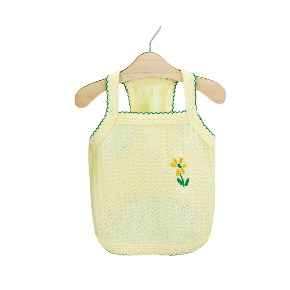 Bright yellow mesh dog tank top with a yellow daisy embroidery and dark green scalloped trim.