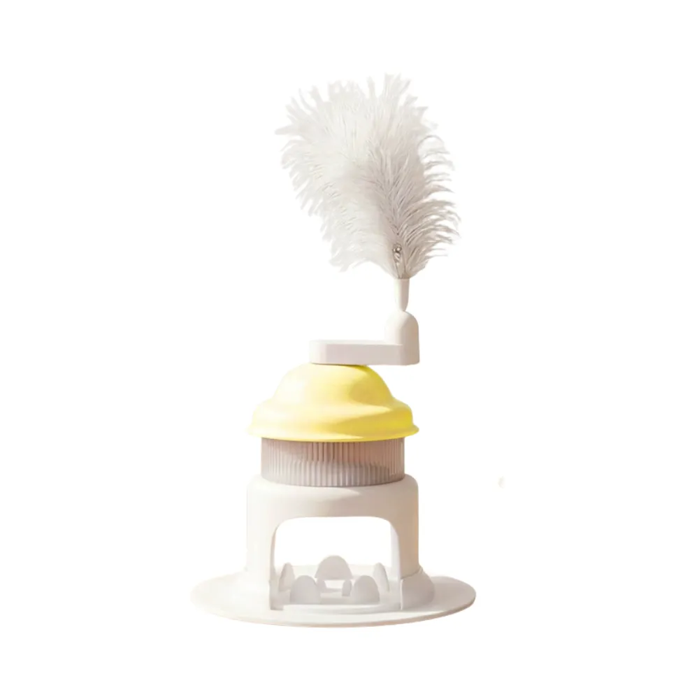 Yellow rotating cat treat dispenser toy with feather teaser isolated on white background