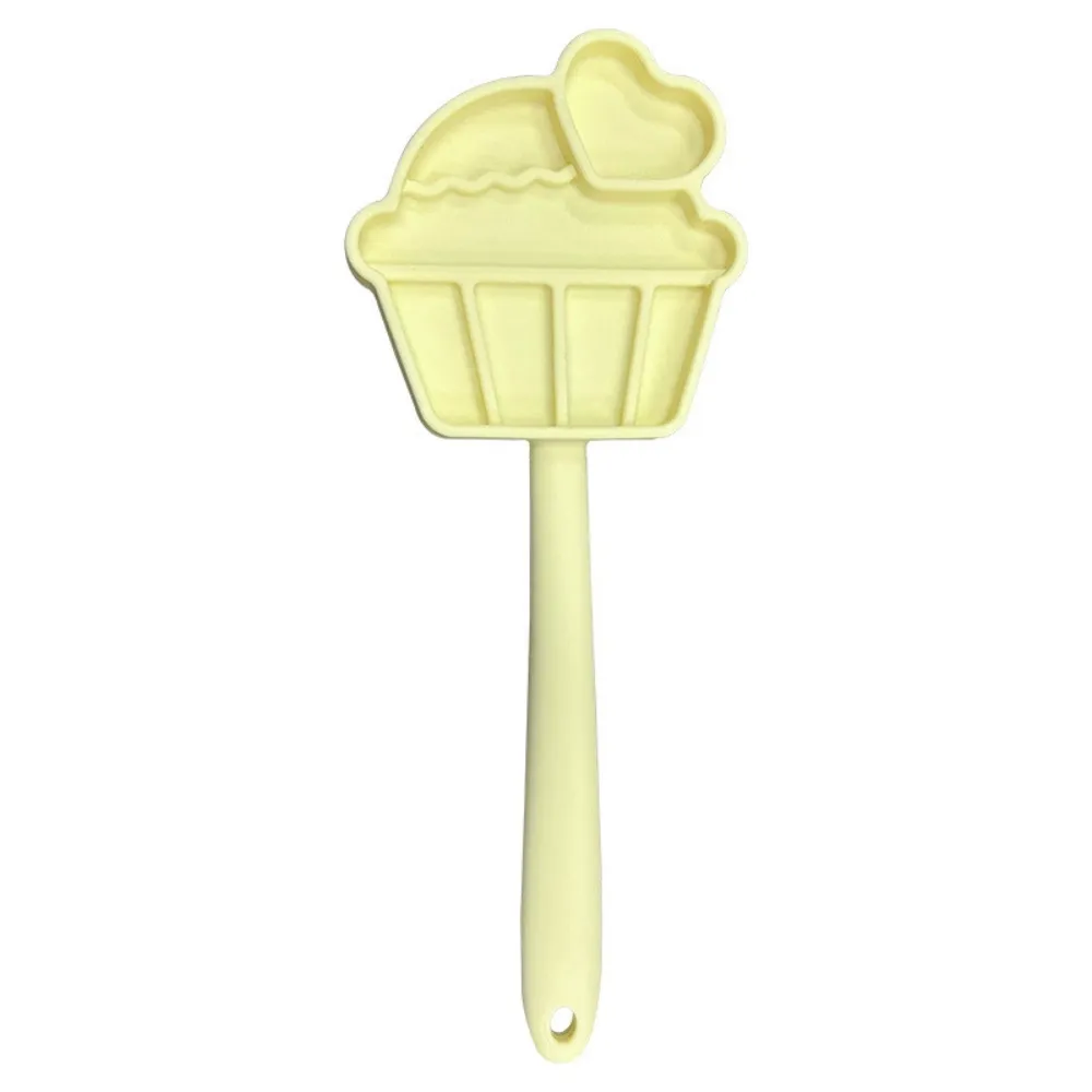 Yellow cupcake-shaped silicone dog licking treat stick for yogurt, wet food and frozen pet snacks