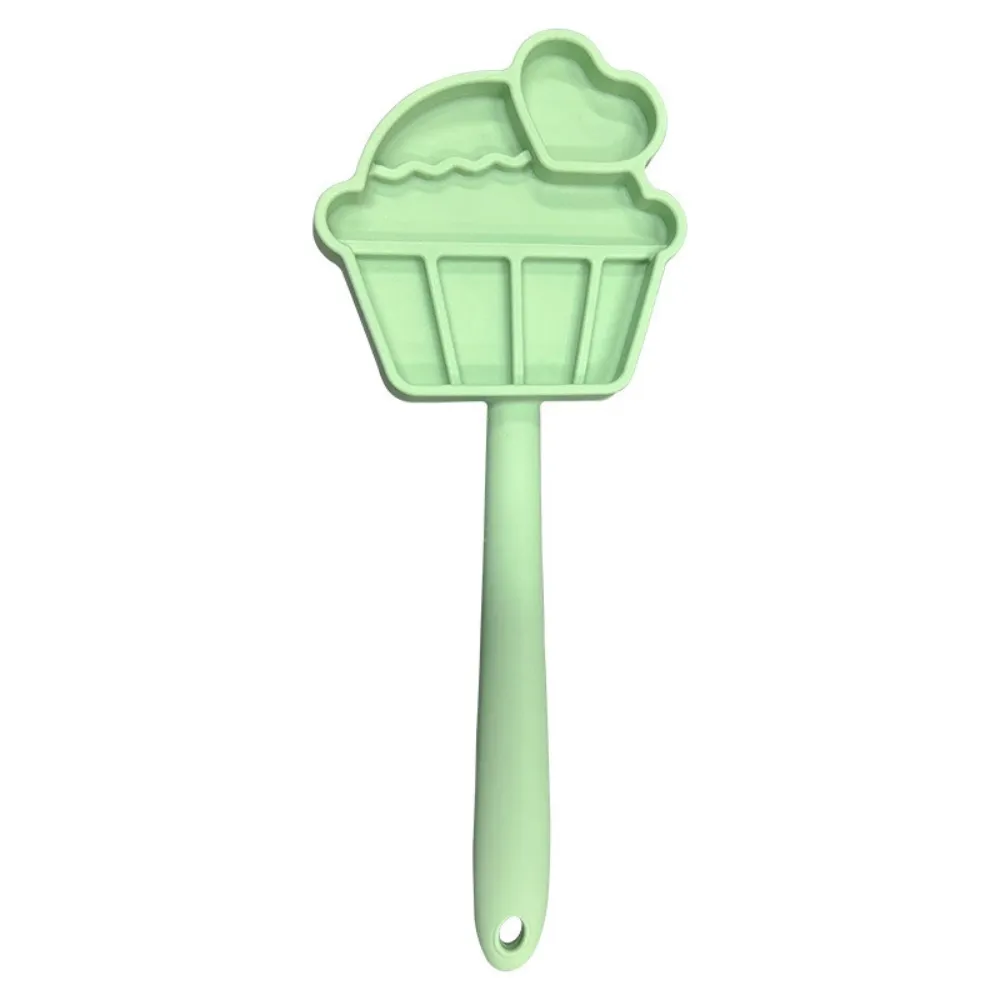 Green reusable silicone pet licking treat stick with cupcake design for healthy pet enrichment