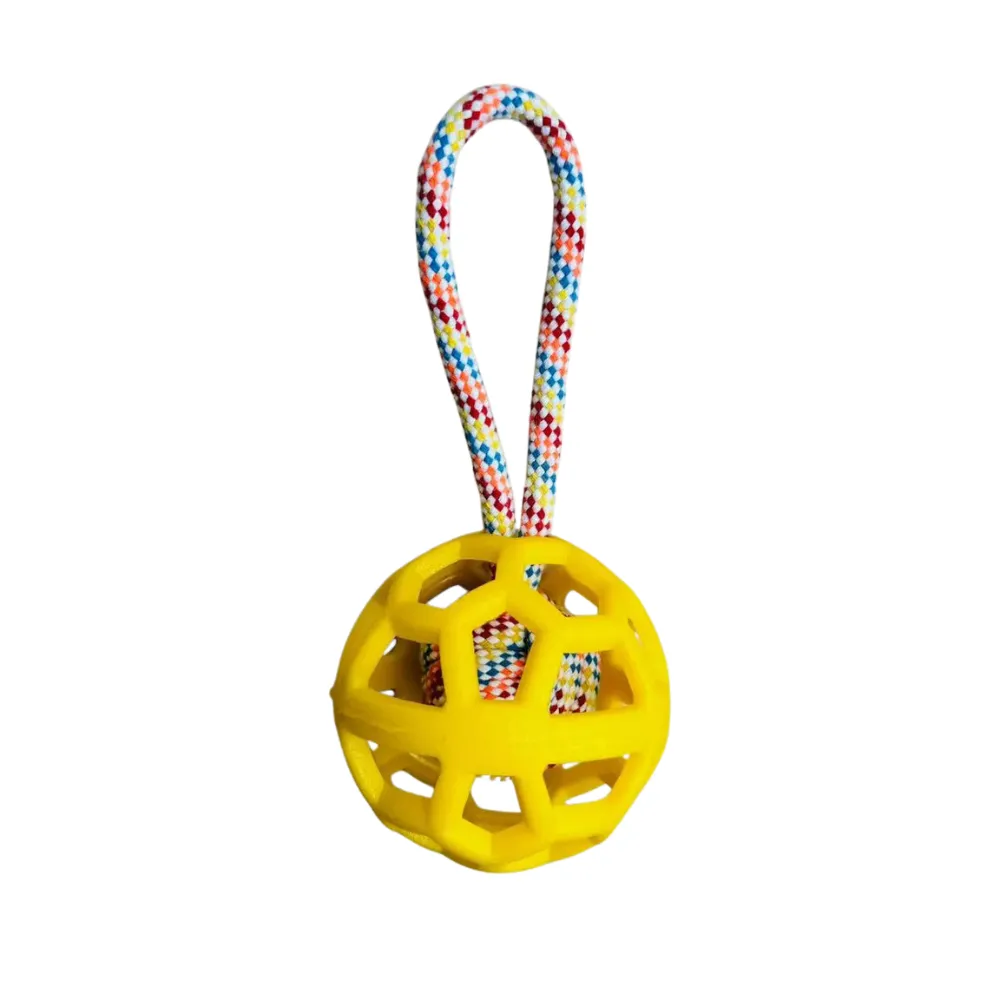 Yellow TPR dog toy ball with braided rope handle for dogs