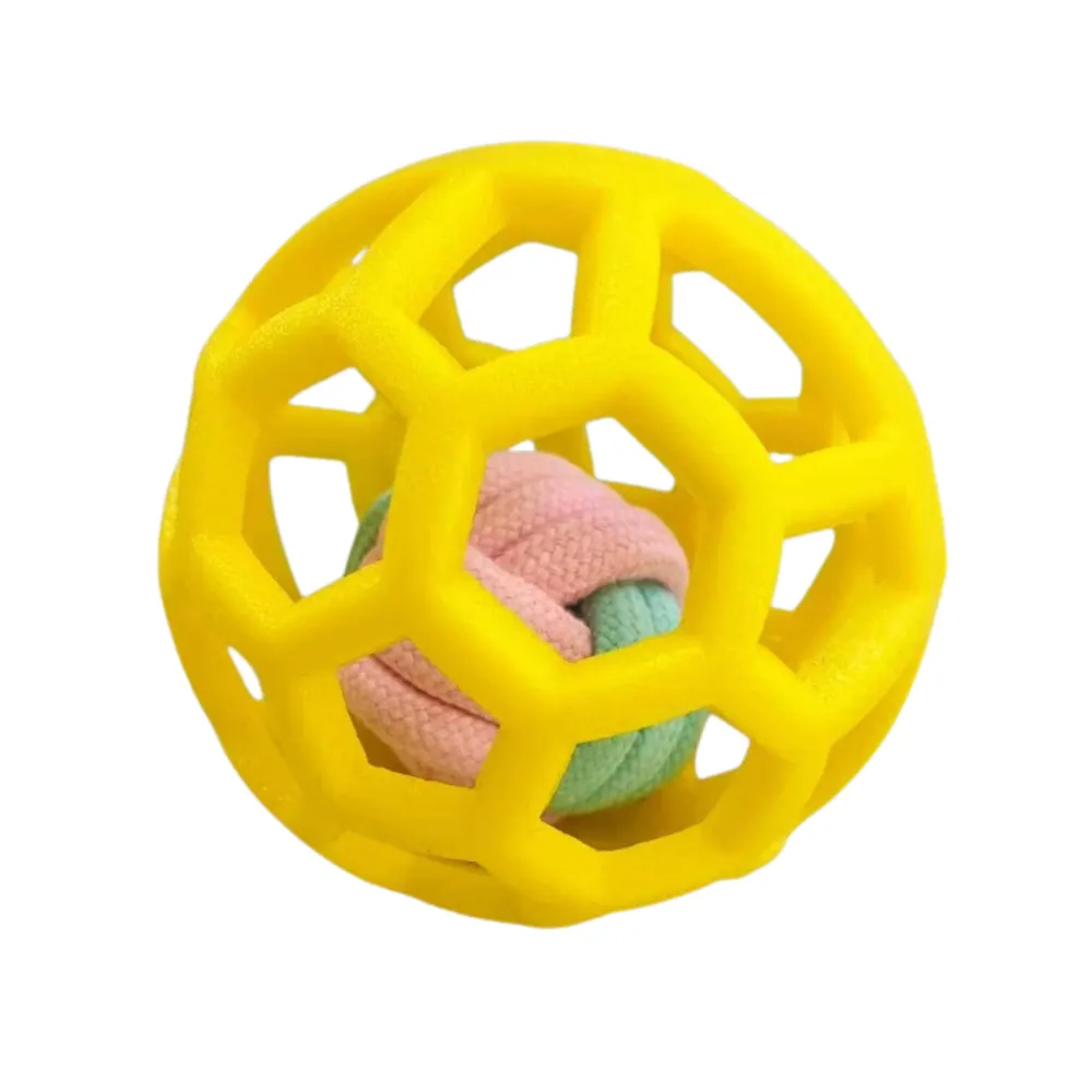 Yellow hollow rubber dog ball toy with rope insert for chewing and training