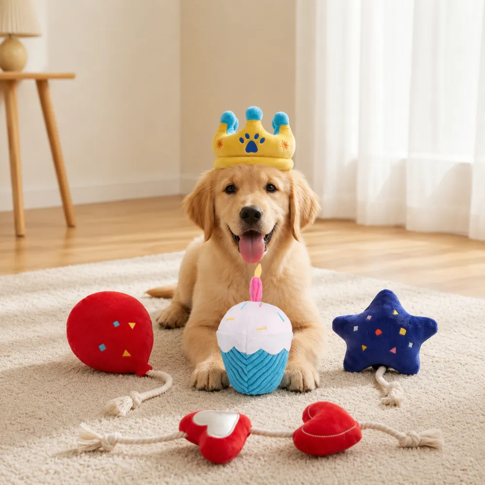 Golden retriever puppy wearing birthday crown surrounded by plush birthday dog toys indoors