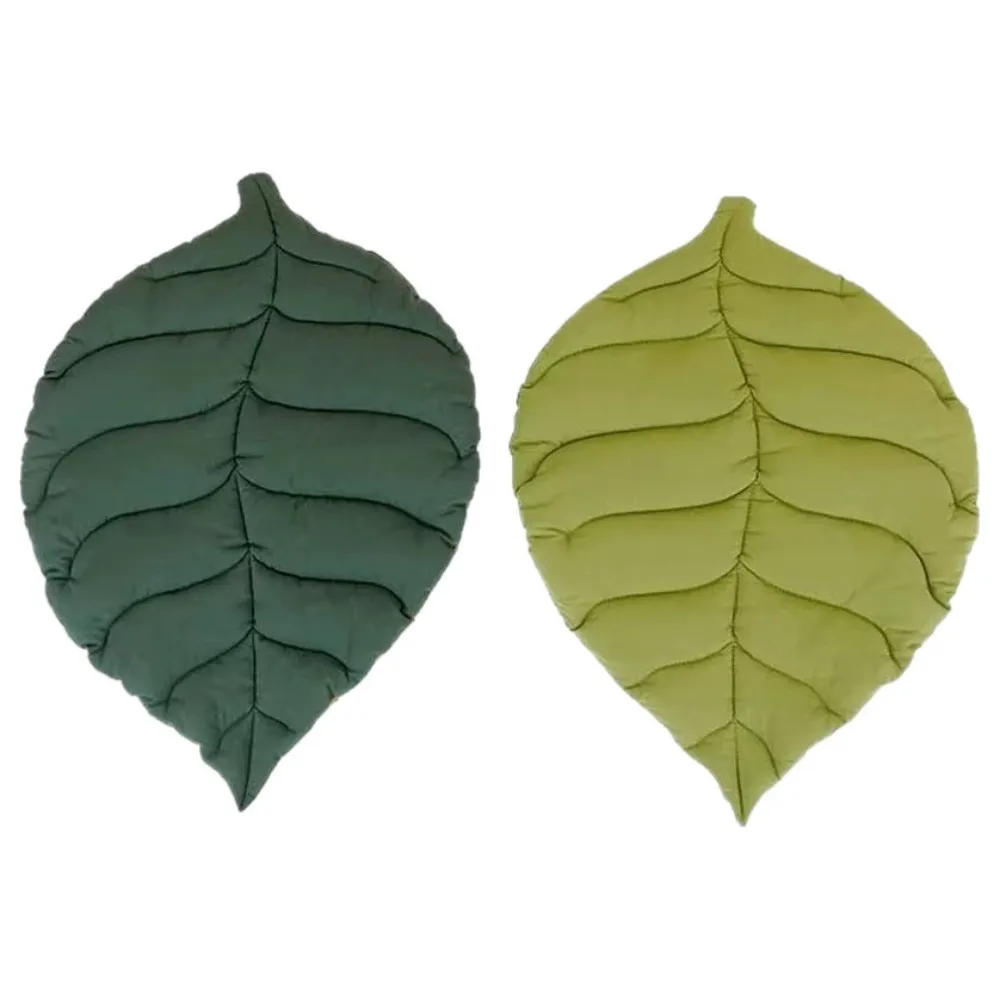 Reversible leaf shaped cat mat with light green and deep green sides for indoor cats