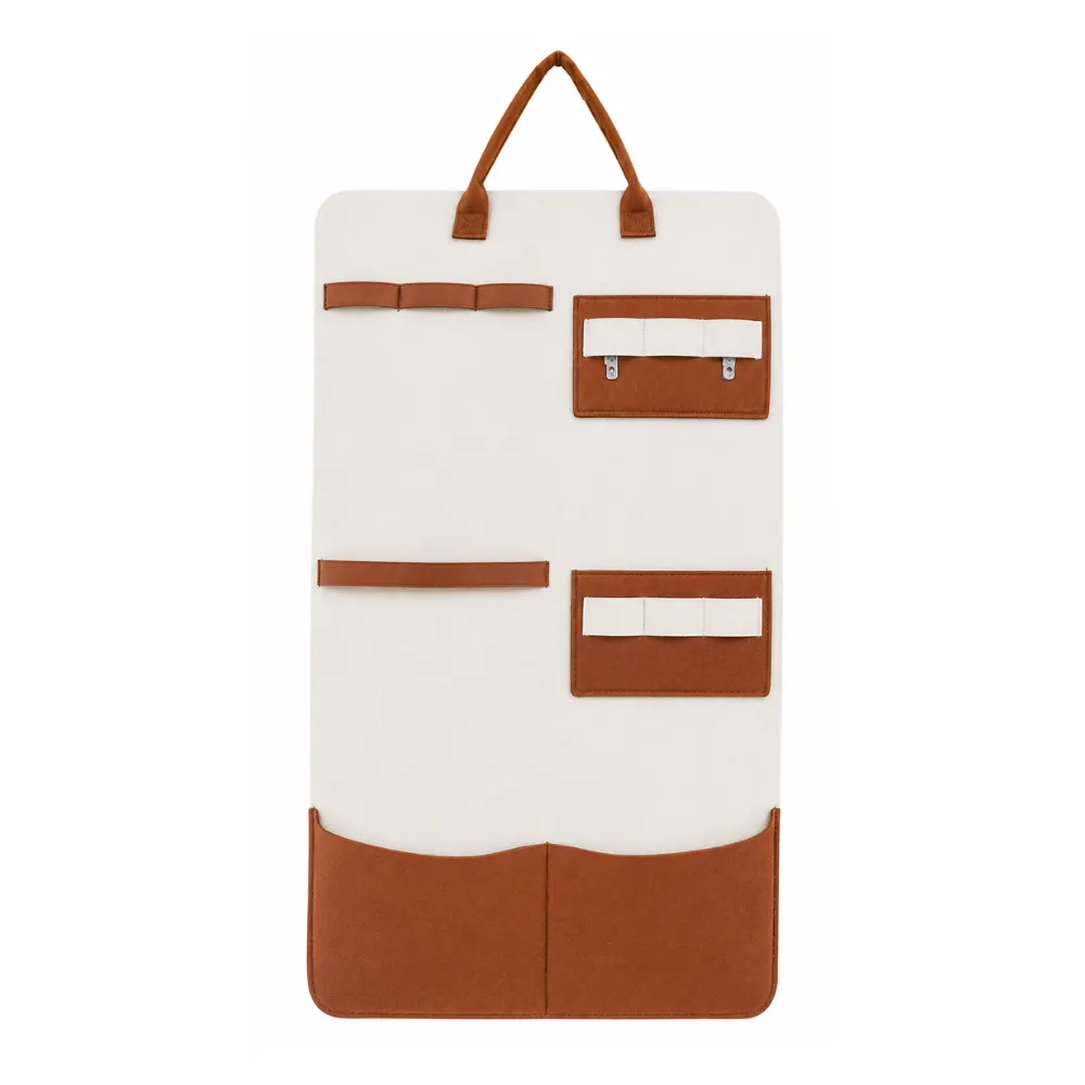 White felt cat toy organizer with leather accents and multi-pocket wall hanging storage design