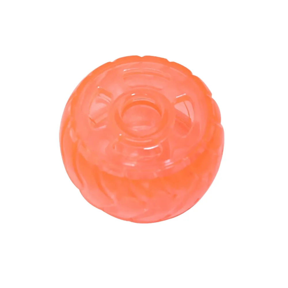 Orange Dog Treat Dispensing Tire Toy Orange translucent dog treat dispensing tire toy on a clean white background