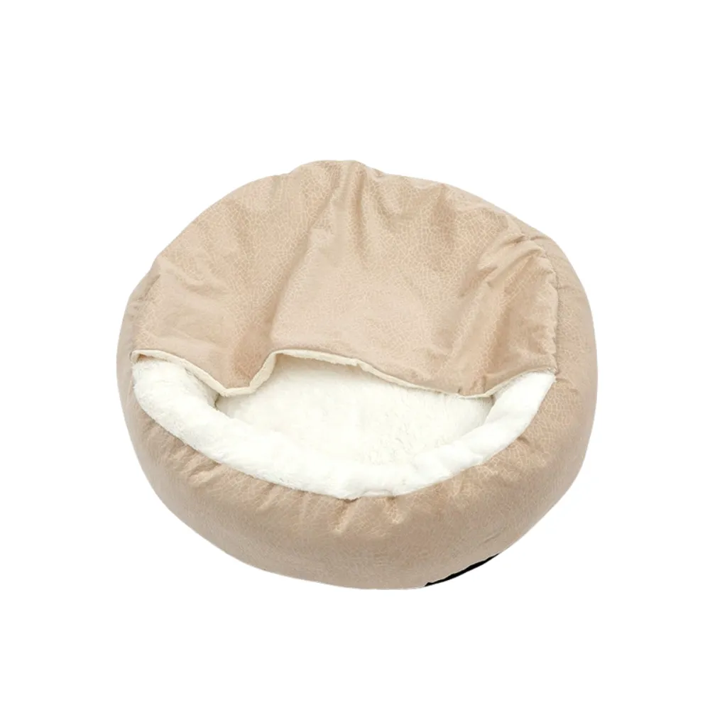 Beige plush shell cat bed with white fleece lining photographed on a white background