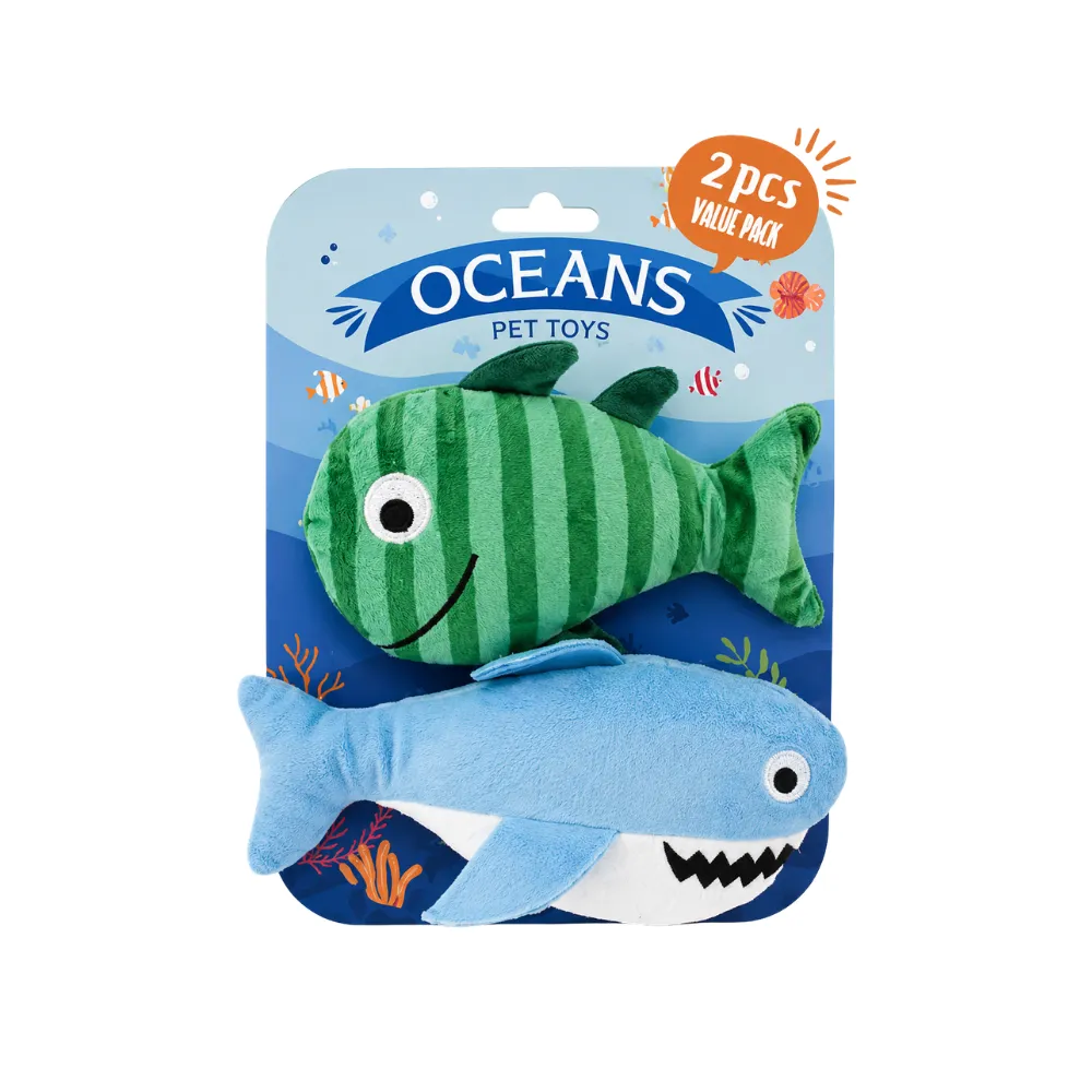 Wholesale Ocean Fish Plush Dog Toy Set Front view of a wholesale ocean fish plush dog toy set with green fish and blue shark in retail packaging.